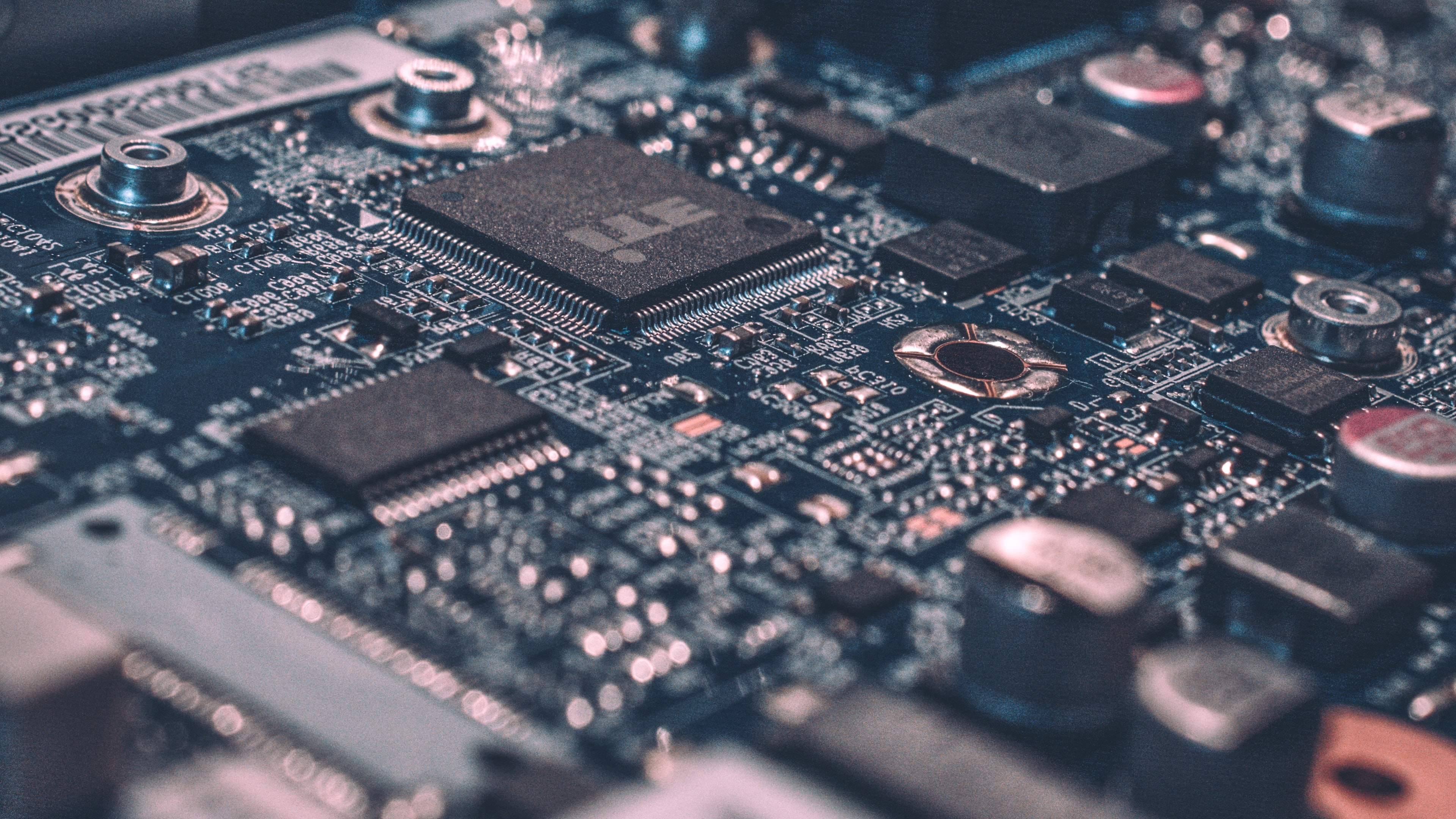 Close-up of a circuit board with microchips, connectors and capacitors